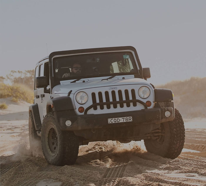 4WD car driving in the sand